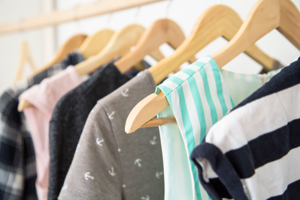 hangers-with-woman-clothes-wardrobe-GZ3WFC6